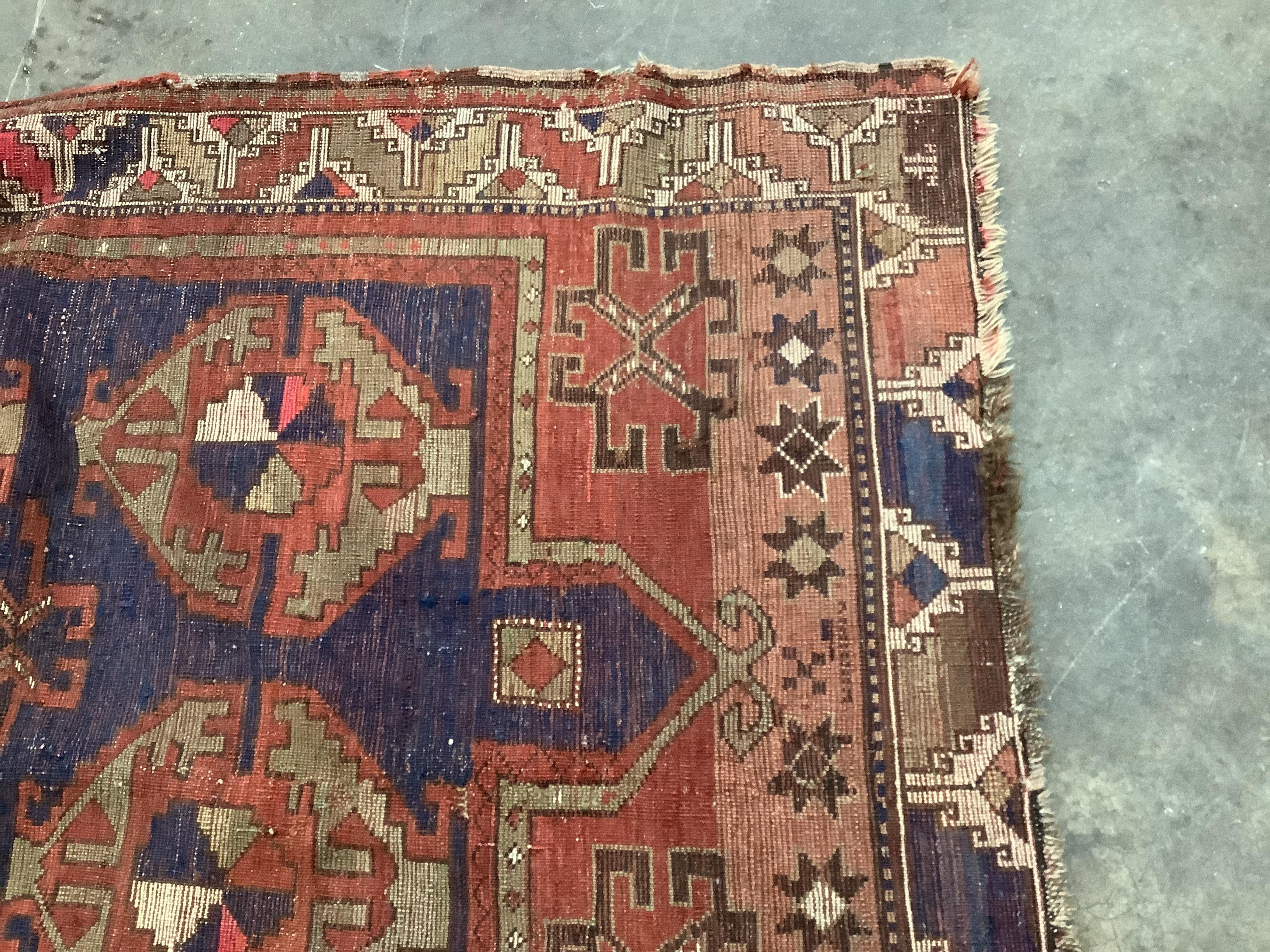 An antique Caucasian blue ground rug, 160 x 115cm